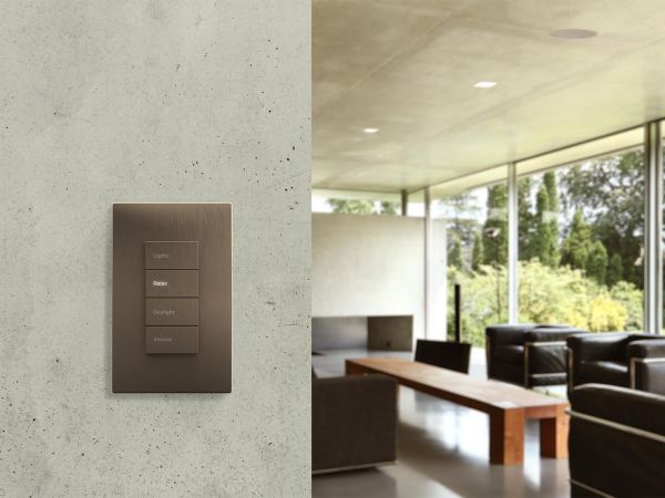 The Savant Ascend keypad with four buttons in a bronze finish, designed for elegant and intuitive control of home systems.