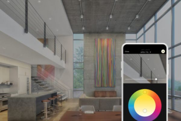 A modern home with an open floor plan, and an overlayed smartphone displaying the Savant App lighting wheel.