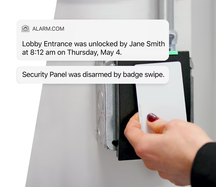 A person swiping an access card to unlock a secure door, with Alarm.com’s real-time notification system highlighting access details for enhanced security monitoring.