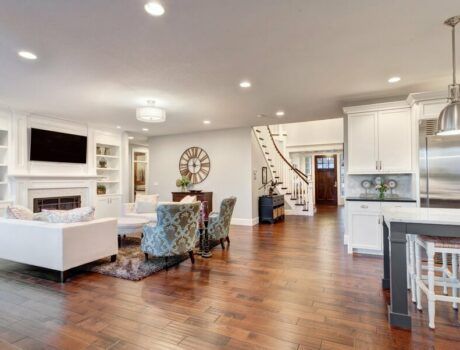 An open living space featuring a variety of smart home solutions like high-end AV and in-ceiling lighting fixtures.