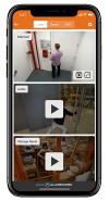 A mobile device displaying the Alarm.com app’s live video monitoring feature, highlighting security camera feeds for a business.