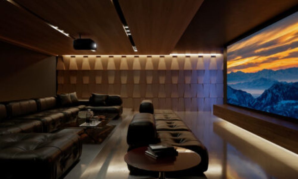 <span class="uk-h4">A casual home theater with a sectional, acoustic paneling, Sony projector, and large movie screen.</span>