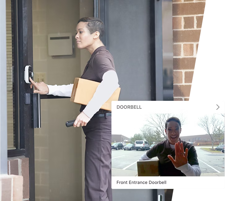 A delivery person interacting with a smart doorbell, integrated with Alarm.com’s live video monitoring system, ensuring secure and efficient package delivery.