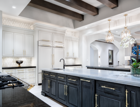 A kitchen space illuminated by Lutron lighting fixtures.