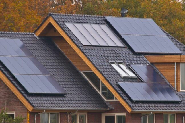 Home roof with solar panels in black