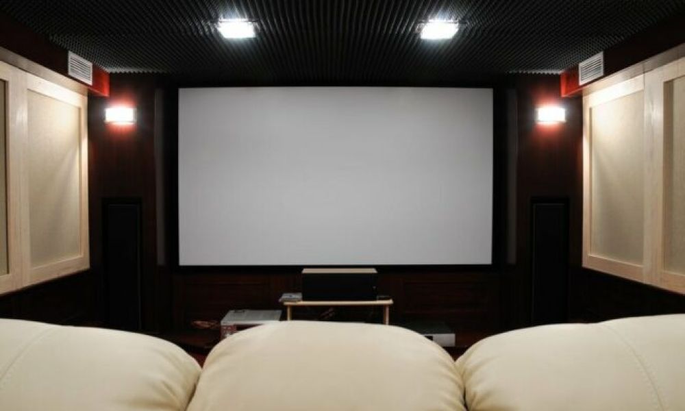 <span class="uk-h4">A private home theater setup featuring a large screen and seating</span>