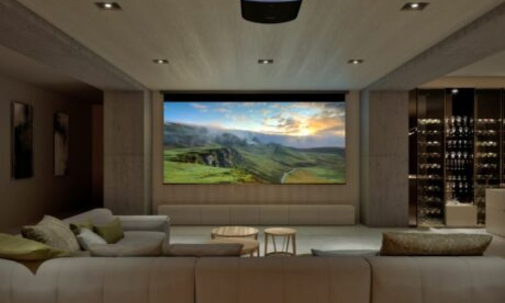 <span class="uk-h4">A casual home theater with a large screen, Sony projector, sectional, and wine bar.</span>