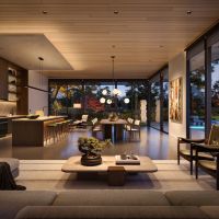 A home with an open floor plan illuminated in a soft, warm glow provided by Lutron lighting.